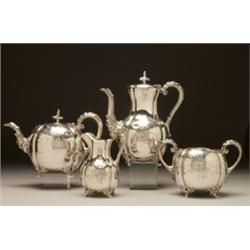 EARLY VICTORIAN SILVER TEA AND COFFEE SERVICE, each fluted melon body engraved with scrolling fol...