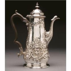 GEORGE II SILVER COFFEE POT, the tapering body with moulded scroll spout and wood handle repoussT...