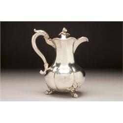VICTORIAN SILVER HOT WATER JUG, of plain lobed baluster form engraved with armorials, with leaf-c...