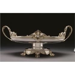 AMERICAN SILVER TWO-HANDLED CENTREPIECE, the shallow oval bowl applied with a fruit cluster, shel...