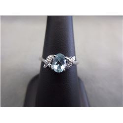 RING - OVAL FACETED LIVELY SKY BLUE TOPAZ & 2 DIAMONDS IN STERLING SILVER SOLITAIRE DESIGNED SETTING