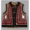 Image 1 : AN EMBROIDERED LEATHER AND WOOL VEST, worked with bright polychrome bands of, flowers and geome...