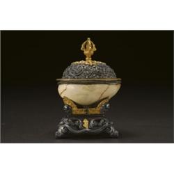 A FINE AND RARE SILVER AND BRONZE KAPALA,, fashioned from a monkey skull, the diminuitive bowl...