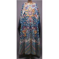 AN EMBROIDERED SILK GAUZE DRAGON ROBE, the blue ground worked with dragons above waves in the con...