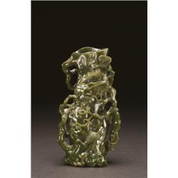 A NEPHRITE JADE TREE FORM VASE, finely worked as a trunk with gnarled roots and branches, ht. 6.7...