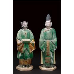 SIX GLAZED POTTERY, FIGURES, of five officials and a woman, all in green glazed robes; from a f...