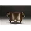 Image 1 : A BRONZE CENSER, of, cylindrical form, undecorated, with elephant head epaulets and tripod supp...