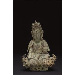 A BRONZE FIGURE OF GUANYIN, seated on a separate lotus throne, the hands in, vitarkamudra, with...