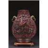 Image 1 : A FINE CINNABAR LACQUER BALUSTER VASE, richly worked with an extensive, paradise landscape with...