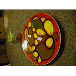 A Poole Pottery Delphis Pattern Charger, 35 cm, and a Sylvac vase, 13 cm