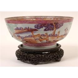 A Famille Rose Bowl, decorated deer and oxon, on a pierced hardwood stand, (a.f.) 26 cm See illustr