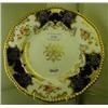 Image 1 : A Coalport Plate, with floral decoration and dark blue panels, within a gilt border