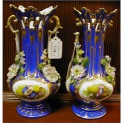 A Pair of Coalport Vases, decorated flowers, on a blue ground (a.f.) 24 cm (2)