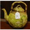 Image 1 : A Majolica Tea Pot and cover, decorated blossom, with a crabstock handle, 22 cm
