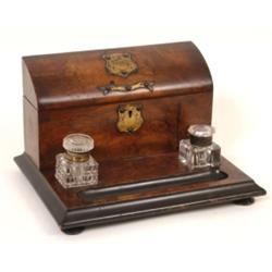 A Victorian Walnut Desk Stand, with lidded stationery compartment, and two inkwells (a.f.) 30 cm Se