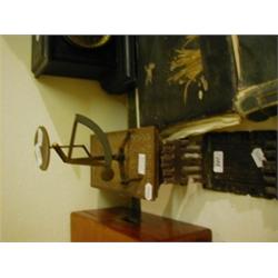 A Set of Brass and Steel Balance Scales, a Black forest style sliding book rack, and a carved walnut