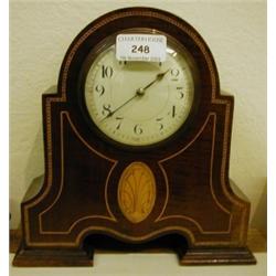 An Edwardian Mantle Clock, with enamel dial and Arabic numerals, in an inlaid mahogany case, 22 cm