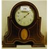 Image 1 : An Edwardian Mantle Clock, with enamel dial and Arabic numerals, in an inlaid mahogany case, 22 cm