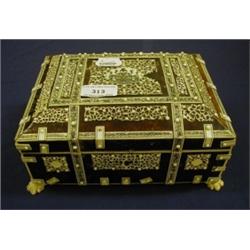 An Indian Sandlewood Tortoiseshell and Ivory Casket, decorated pierced scroll work, on claw feet, 22