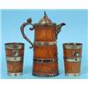 Image 1 : A Late Victorian Oak Jug, the plated mounts with face mask spout, and a pair of matching beakers (3)