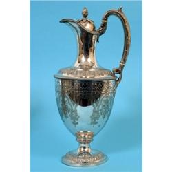 A Victorian Plated Claret Jug, with pineapple finial, and acanthus leaf capped scroll handle, the bo