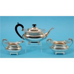 A George III Style Silver Three Piece Tea Service, with gadroon and shell edging, on four ball feet,