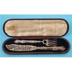 A Pair of Victorian Silver Fish Servers, monogrammed, with acanthus and scroll mounted handles, Birm