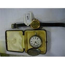 A 14ct Gold Wristwatch, with Roman numerals in a foliate engraved case, and a silver pocket watch (a