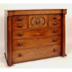 A William IV Scottish Mahogany Chest, having a central bonnet drawer, four short drawers and three g