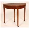 Image 1 : An Edwardian Mahogany Card Table, the demi-lune fold over top on square tapering legs, 77 cm See il