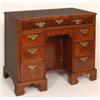 Image 1 : An Early 18th Century Style Kneehole Desk, veneered in walnut, having a frieze drawer above a kneeho