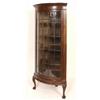 Image 1 : A Bow Front Corner Display Cabinet, the moulded cornice above a single astragal glazed door, on carv