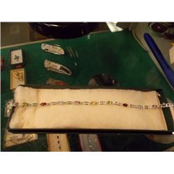 BRACELET - MULTI-GEMSTONE & DIAMOND IN STERLING SILVER SETTING - 9 OVAL FACETED GEMS - ESTIMATED RET