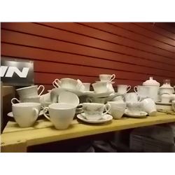 TEA CUPS AND SAUCERS