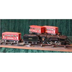 A Lionel Lines electric locomotive and tender - three rail together with two pullman and one obs...