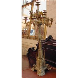 An impressive pair of large brass Gothic thirteen branch candelabra...
