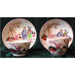 An early 19th century tea bowl and saucer with painted decoration depicting Oriental figures, po...