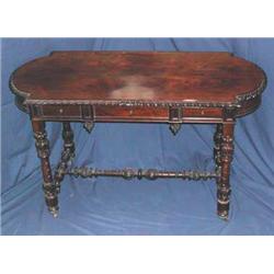 A good 19th century carved rosewood silver table on turned stretchered supports...