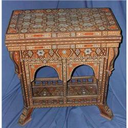 A fine Moorish games table profusely inlaid with sandalwood, mother-of-pearl, rosewood and other...