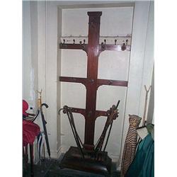 A VICTORIAN MAHOGANY BOOTJACK,, THIRD quarter 19th Century, with ring-turned twin supports on hing..