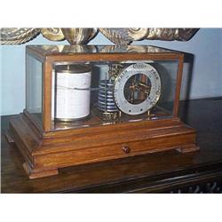 AN EDWARDIAN MAHOGANY BAROGRAPH,, circa 1900-10, in a pale mahogany case, the base fitted with a d..