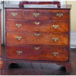 A GEORGE III MAHOGANY AND OAK CHEST, LATE 18th CENTURY, of three short and three long drawers on lat
