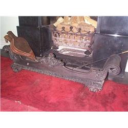 A WILLIAM IV CAST-IRON FENDER, circa 1835,, of rectangular form with solid scrolled ends and folia..