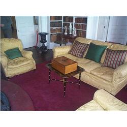 AN EDWARDIAN UPHOLSTERED THREE-SEAT SOFA, circa 1900-10, on stained-beech bun feet and, castors; t..