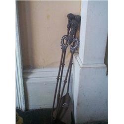 A SET OF THREE VICTORIAN STEEL AND CAST-IRON FIRE-IRONS, circa 1850, with foliate baluster handles,.