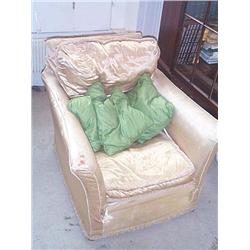 AN EDWARDIAN WALNUT EASY ARMCHAIR, circa 1910, with rectangular back and outsplayed sides, covered i