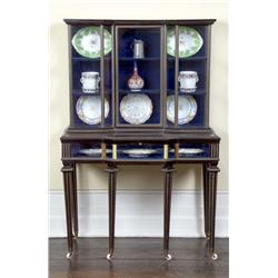 A VICTORIAN BRASS AND EBONY DISPLAY, CABINET, circa 1860-70, with inverted breakfront glazed super..