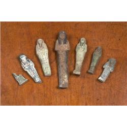 SIX Egyptian Shabti's, including a painted wooden shabti with column of hieroglyphs circa 1300 BC, a