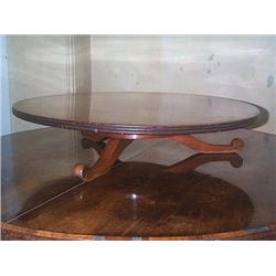 AN EARLY VICTORIAN MAHOGANY CIRCULAR LAZY SUSAN, by HOLLAND & SONS, circa 1840,, the revolving top..