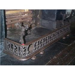 A WILLIAM IV CAST-IRON FENDER, circa 1835, of rounded rectangular form with pierced foliate frieze,.